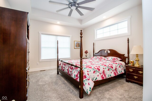 2686 Lafayette Ave, Columbus, IN 47201 - carpeted bedroom with a tray ceiling, recessed lighting, ceiling fan, and baseboards