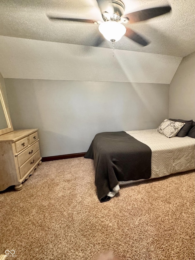 3559 S County Road 475 E, Plainfield, IN 46168 - bedroom with a textured ceiling, light carpet, vaulted ceiling, and ceiling fan