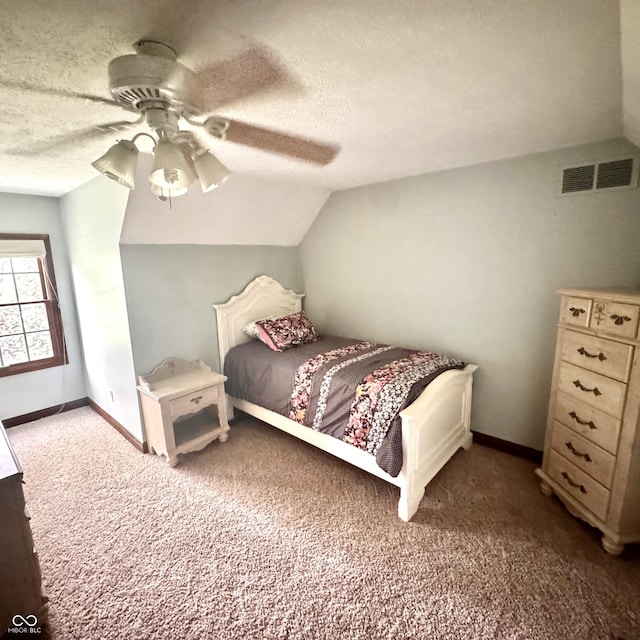 3559 S County Road 475 E, Plainfield, IN 46168 - carpeted bedroom featuring lofted ceiling, a textured ceiling, baseboards, and ceiling fan
