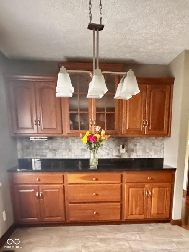 3559 S County Road 475 E, Plainfield, IN 46168 - bar featuring tasteful backsplash, baseboards, a textured ceiling, and pendant lighting