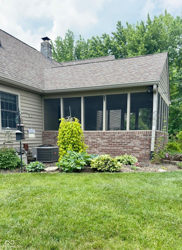 3559 S County Road 475 E, Plainfield, IN 46168 - view of front of property with a sunroom, central AC unit, and brick siding