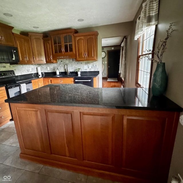 3559 S County Road 475 E, Plainfield, IN 46168 - kitchen with black appliances, a sink, tasteful backsplash, and brown cabinetry