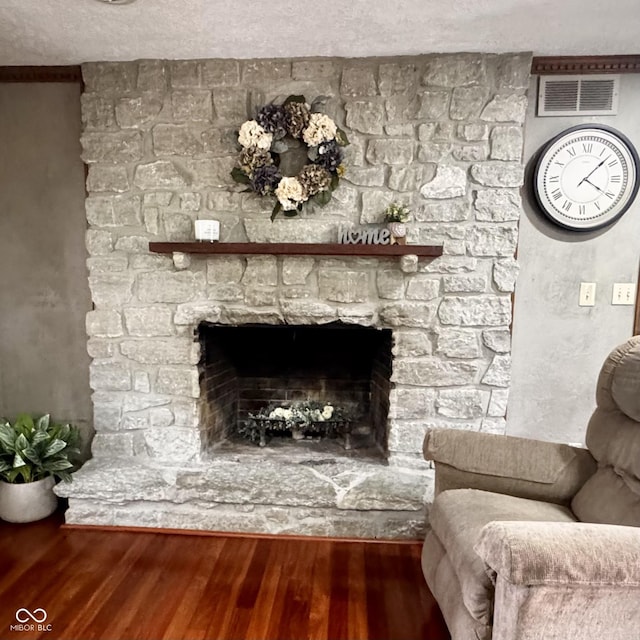 3559 S County Road 475 E, Plainfield, IN 46168 - living room featuring wood finished floors, a fireplace, and a textured ceiling