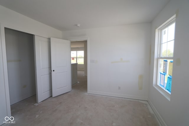 7323 Waylon Way, Indianapolis, IN 46239 - unfurnished bedroom with baseboards and a closet