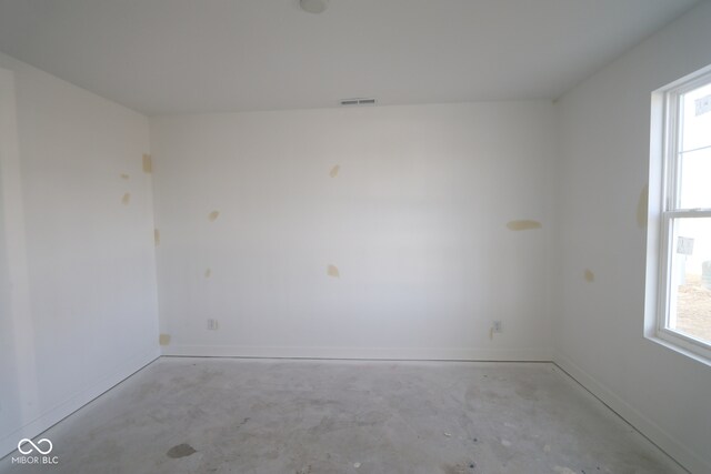 7323 Waylon Way, Indianapolis, IN 46239 - empty room featuring concrete flooring and baseboards
