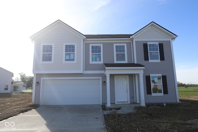 7323 Waylon Way, Indianapolis, IN 46239 - view of front of house featuring concrete driveway and an attached garage