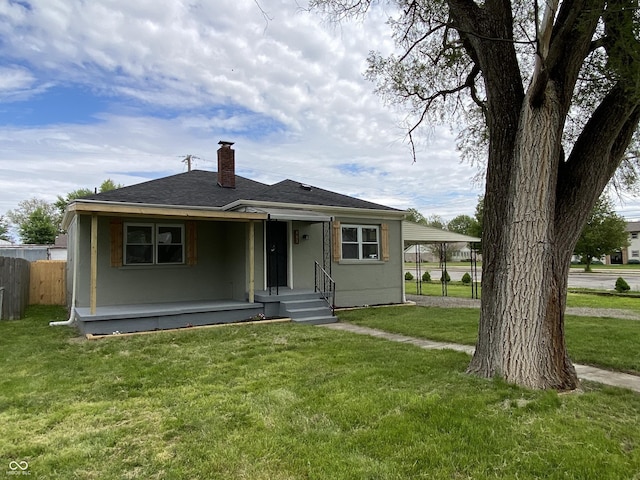 453 Illinois St, Fortville, IN 46040 - bungalow-style house with a chimney, a shingled roof, a carport, stucco siding, and covered porch