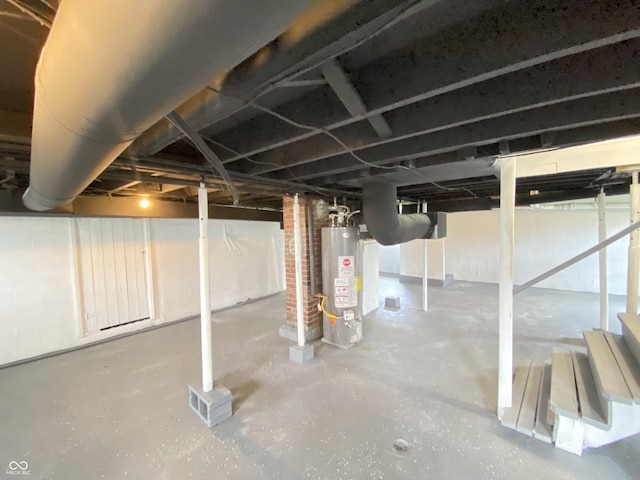 453 Illinois St, Fortville, IN 46040 - unfinished basement featuring gas water heater and stairs