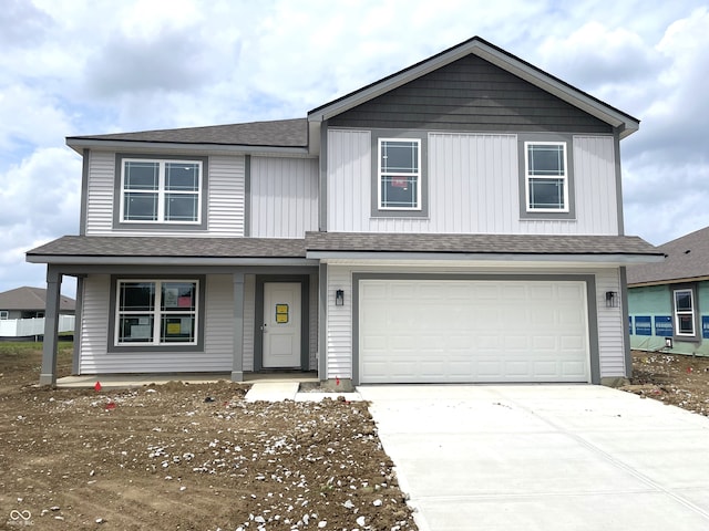 1204 Mcbride St, Greenfield, IN 46140 - view of front facade with a porch, driveway, a garage, and roof with shingles