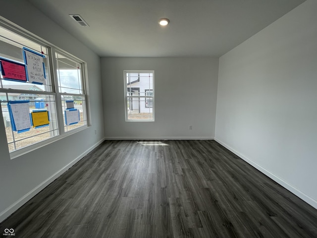 1204 Mcbride St, Greenfield, IN 46140 - spare room with dark wood-style floors and baseboards