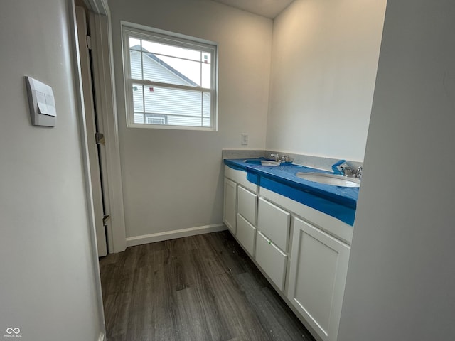 1204 Mcbride St, Greenfield, IN 46140 - bathroom featuring wood finished floors and double vanity