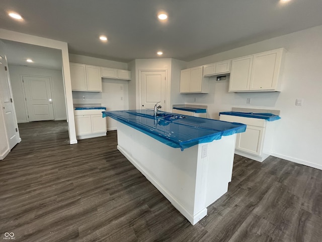 1204 Mcbride St, Greenfield, IN 46140 - kitchen featuring white cabinetry, dark wood finished floors, a kitchen island with sink, and recessed lighting