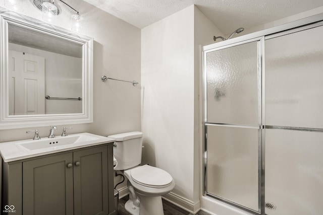 11419 Niagara Dr, Fishers, IN 46037 - full bath featuring toilet, a shower stall, vanity, a textured ceiling, and wood finished floors