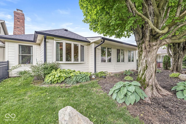 12388 Camberley Ln, Carmel, IN 46033 - view of side of home featuring a chimney and roof with shingles