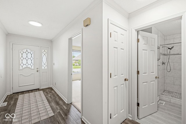 12388 Camberley Ln, Carmel, IN 46033 - entrance foyer with wood finished floors, crown molding, and baseboards