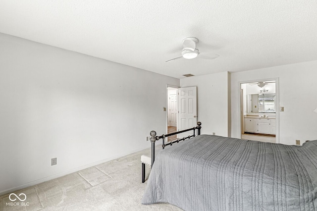 12388 Camberley Ln, Carmel, IN 46033 - carpeted bedroom with ceiling fan, ensuite bath, and a textured ceiling