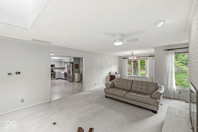 12388 Camberley Ln, Carmel, IN 46033 - living area with a textured ceiling, a ceiling fan, baseboards, a chandelier, and light carpet