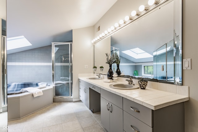 12469 Springmill Rd, Carmel, IN 46032 - full bath with a skylight, a stall shower, a garden tub, tile patterned floors, and double vanity