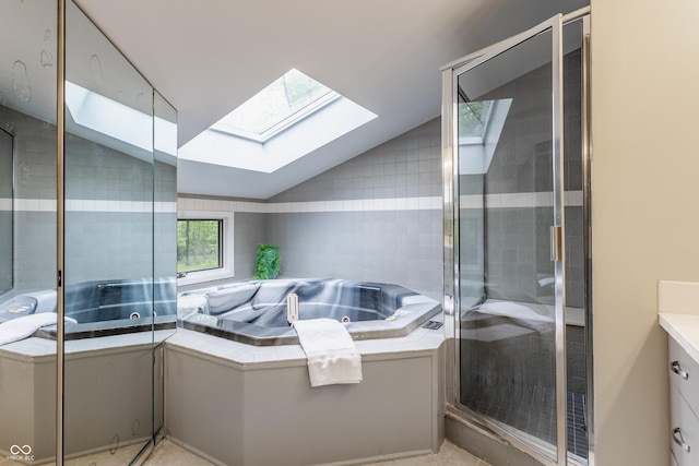 12469 Springmill Rd, Carmel, IN 46032 - full bath with a skylight, a shower stall, lofted ceiling, vanity, and a jetted tub