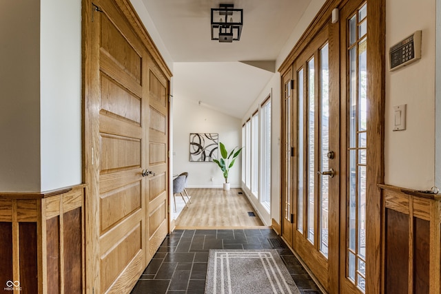 12469 Springmill Rd, Carmel, IN 46032 - corridor featuring stone tile floors, plenty of natural light, and lofted ceiling