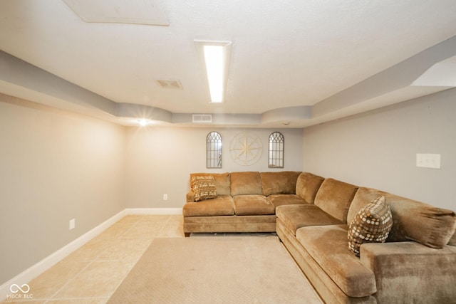 living room featuring light tile patterned flooring and baseboards