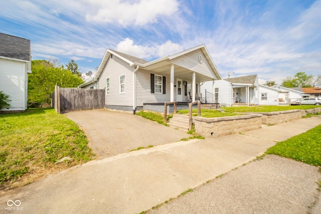 view of front of home with covered porch and asphalt driveway