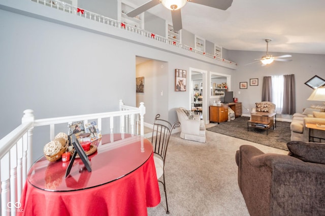 living area with a ceiling fan, carpet flooring, and lofted ceiling