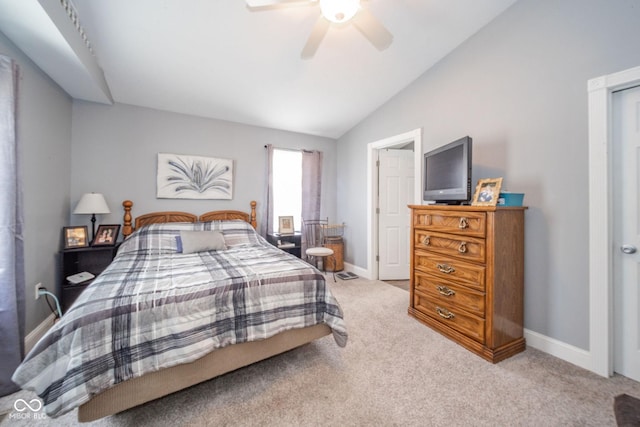 carpeted bedroom featuring vaulted ceiling, baseboards, and a ceiling fan