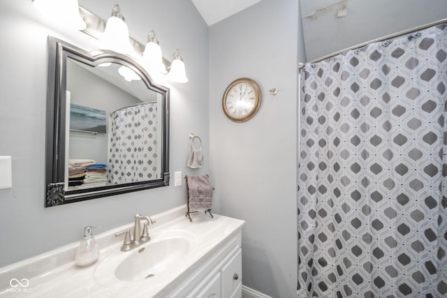 full bathroom with vanity and a shower with shower curtain