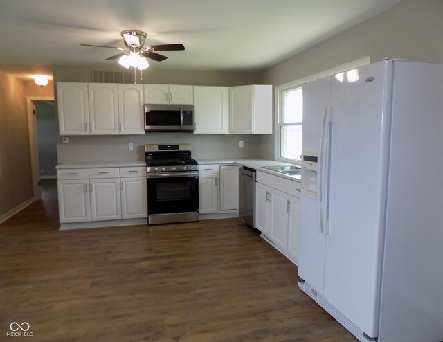 9739 S County Road 825 E, Cloverdale, IN 46120 - kitchen featuring appliances with stainless steel finishes, white cabinets, ceiling fan, dark wood finished floors, and light countertops