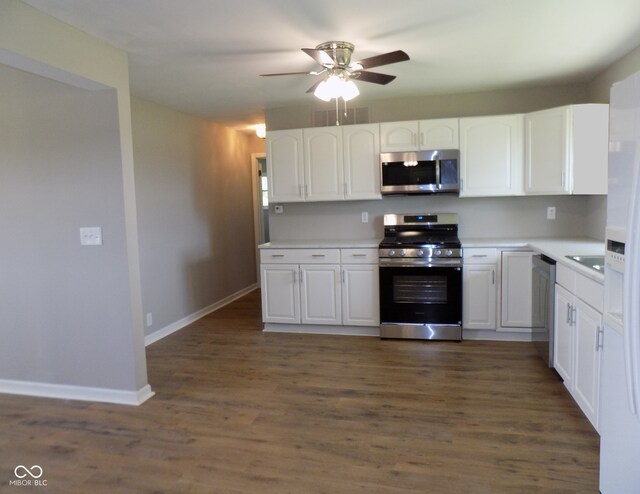 9739 S County Road 825 E, Cloverdale, IN 46120 - kitchen with appliances with stainless steel finishes, white cabinets, ceiling fan, dark wood finished floors, and light countertops