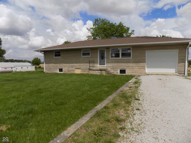 9739 S County Road 825 E, Cloverdale, IN 46120 - ranch-style home featuring an attached garage, a chimney, a front yard, gravel driveway, and stone siding