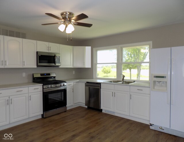 9739 S County Road 825 E, Cloverdale, IN 46120 - kitchen featuring appliances with stainless steel finishes, a sink, white cabinets, a ceiling fan, and light countertops