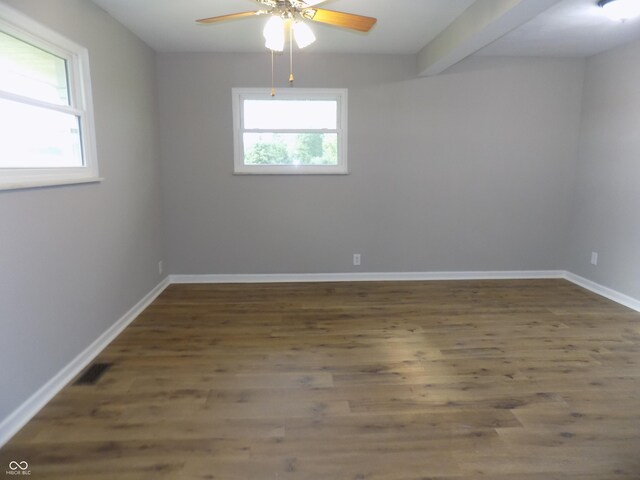 9739 S County Road 825 E, Cloverdale, IN 46120 - spare room with ceiling fan, wood finished floors, baseboards, and beamed ceiling