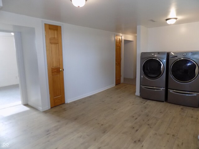 9739 S County Road 825 E, Cloverdale, IN 46120 - laundry area with separate washer and dryer, light wood-style flooring, and baseboards