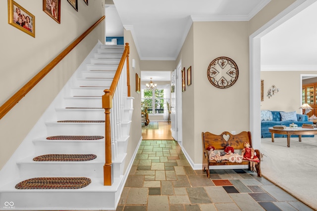 610 N Forest Rd, Crawfordsville, IN 47933 - staircase with stone tile flooring, a chandelier, ornamental molding, and baseboards