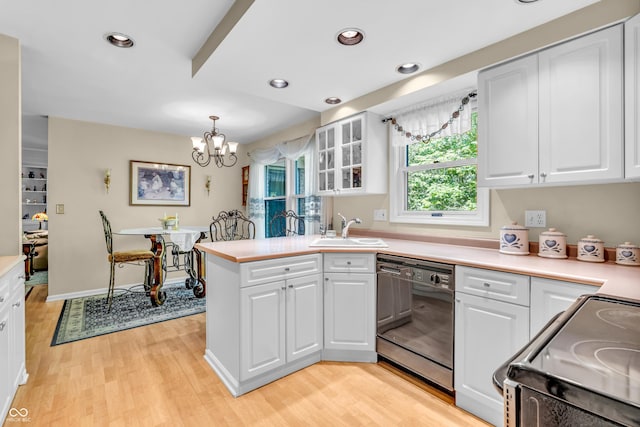 610 N Forest Rd, Crawfordsville, IN 47933 - kitchen with black appliances, a sink, white cabinets, a chandelier, and light wood-style floors