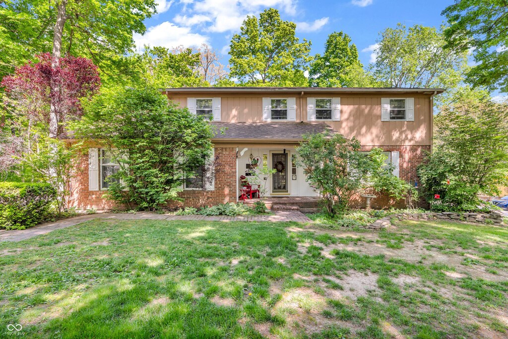 610 N Forest Rd, Crawfordsville, IN 47933 - view of front of home with brick siding and a front yard
