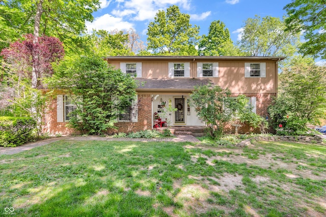 610 N Forest Rd, Crawfordsville, IN 47933 - view of front of home with brick siding and a front yard