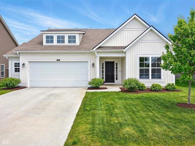 4367 Homestead Dr, Whitestown, IN 46075 - view of front facade featuring board and batten siding, a garage, a front yard, driveway, and a shingled roof