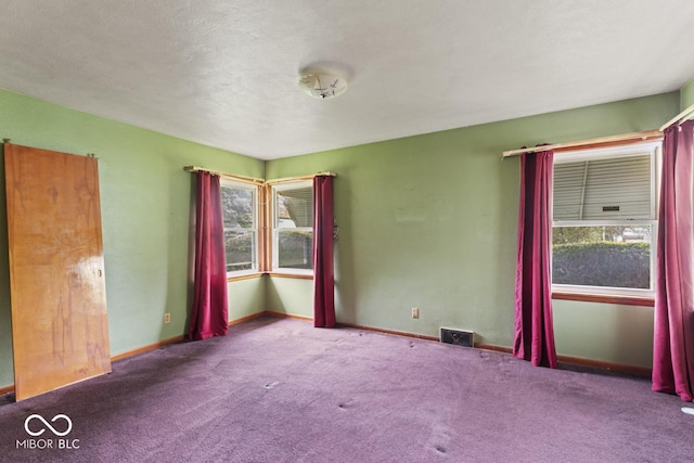 2840 W 12th St, Anderson, IN 46011 - carpeted empty room featuring plenty of natural light and baseboards
