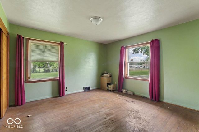 2840 W 12th St, Anderson, IN 46011 - spare room featuring hardwood / wood-style floors and baseboards