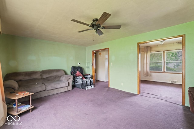 2840 W 12th St, Anderson, IN 46011 - carpeted living area with a ceiling fan and baseboards