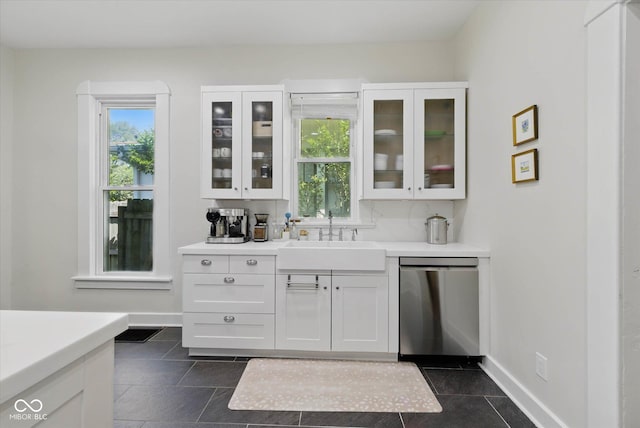 1132 Evison St, Indianapolis, IN 46203 - bar featuring a sink, dishwasher, baseboards, and dark tile patterned flooring