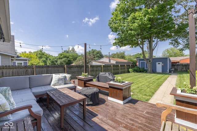 1132 Evison St, Indianapolis, IN 46203 - wooden deck featuring outdoor lounge area, an outbuilding, and grilling area