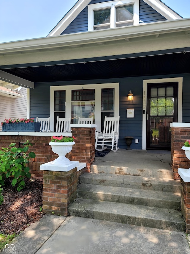1132 Evison St, Indianapolis, IN 46203 - view of exterior entry featuring a porch