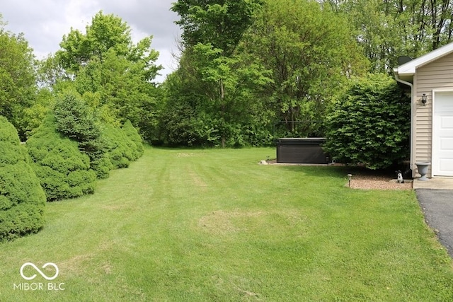7 Gladiator Dr, Waynetown, IN 47990 - view of green lawn with a hot tub