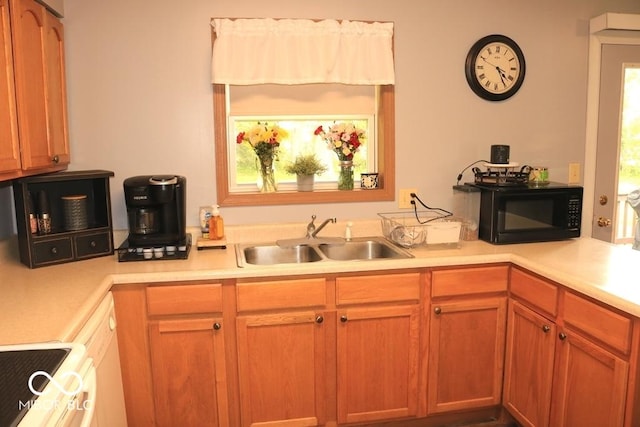 7 Gladiator Dr, Waynetown, IN 47990 - kitchen with black microwave, a sink, light countertops, and range