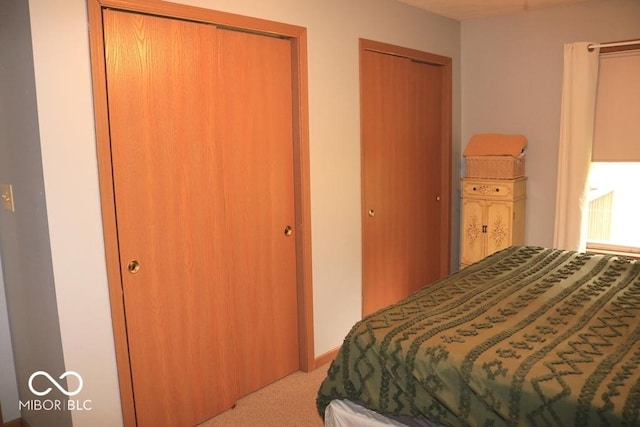 7 Gladiator Dr, Waynetown, IN 47990 - bedroom featuring two closets, carpet flooring, and radiator