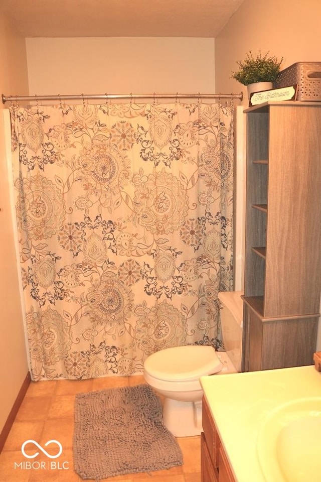 7 Gladiator Dr, Waynetown, IN 47990 - full bathroom with toilet, vanity, a shower with curtain, tile patterned floors, and baseboards